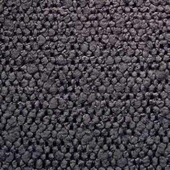 Dark gray fabric texture with a dense, granular surface of rounded elements; uneven, matte finish; sample labeled “g vlt101”.