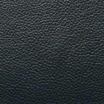 Black leather texture sample displaying a pebble grain pattern, labeled “presotto nero 9r,” with a matte finish and subtle tonal variations.
