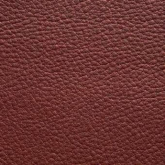 Reddish-brown leather texture, Presotto “xt nhy53374”, displays a granular, matte finish with dense, irregular bumps and subtle shading variations.
