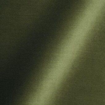 Olive green fabric texture with matte finish, diagonal light highlight, and subtle tonal variations; label reads "reflex > fabric > amsterdam > 38 woodland."