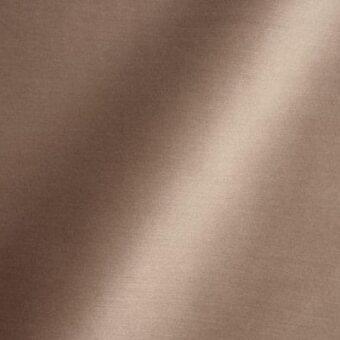 Brown woven fabric texture with subtle vertical striations and integrated text reading “reflex > fabric > amsterdam > 44 barley”.