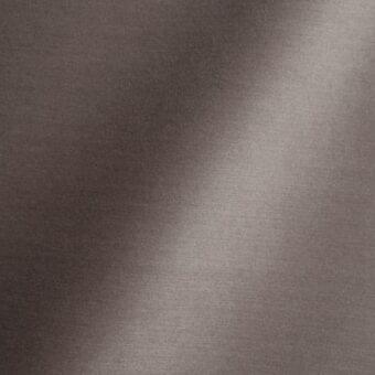 Dark brown woven fabric texture with subtle sheen, displaying a vertical light gradient and imprinted text: “reflex > fabric > fabric (extra) > amsterdam > 46 star”.