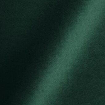 Dark fern green upholstery fabric with subtle sheen, textured weave, and diagonal gradient; “reflex” fabric sample detail.