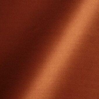Tamarillo fabric texture with a satin sheen, displaying a reddish-brown hue and diagonal highlight, identified as Reflex Amsterdam 49.
