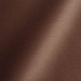 Brown woven fabric texture with subtle sheen, displaying imprinted text “reflex > fabric > amsterdam > 54 saycamore” and diagonal light gradient.