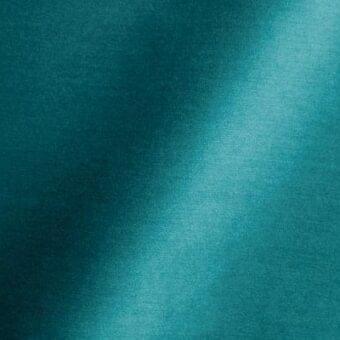 Teal fabric swatch with matte texture, diagonal light gradient, and woven appearance; includes “reflex fabric” and “57 atoll” text.