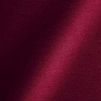 Red satin fabric texture displaying folds and sheen, with “reflex” branding and “63 hibiscus” color code, Amsterdam origin.