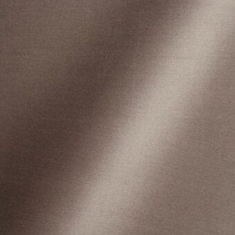 Fabric texture sample, brownish-gray “64 Clay Creek” color, matte finish with sheen, vertical light gradient, woven material, Reflex Amsterdam collection.