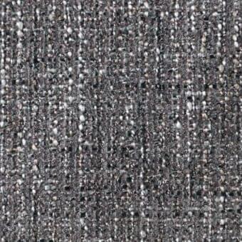 Charcoal gray woven fabric texture with off-white and brown flecks, dense irregular weave, nubby surface, “reflex dublino tiber” material.