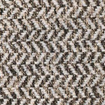 Herringbone fabric texture with light beige and dark brown diagonal weave, displaying a subtle sheen and “reflex ginevra crocodile” label.