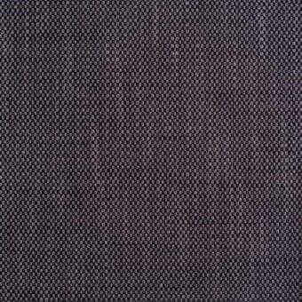 Dark gray woven fabric texture with speckled highlights, dense square weave, matte finish, and faint alphanumeric markings throughout.