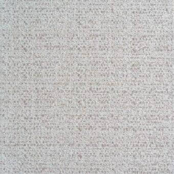 Beige fabric sample with speckled brown threads, dense woven texture, visible irregularities, and “reflex” label indicating brand/collection.