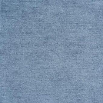 Blue-gray fabric swatch with dense woven texture, matte finish, and subtle tonal variations; “reflex” fabric branding visible in corner.