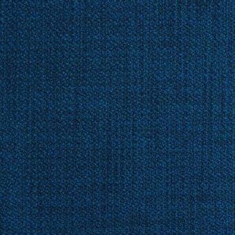 Deep blue fabric texture with a dense, granular pattern and matte finish; speckled surface suggests durable upholstery or carpet material.