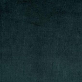 Corduroy fabric swatch in muted teal displays fine vertical wales, creating a ribbed texture with a dense, plush matte finish.