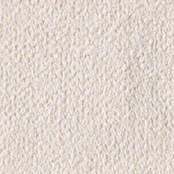 Ecru fabric texture with short, dense pile and matte finish; tightly woven fibers create a granular appearance, labeled “reflex via baguta”.