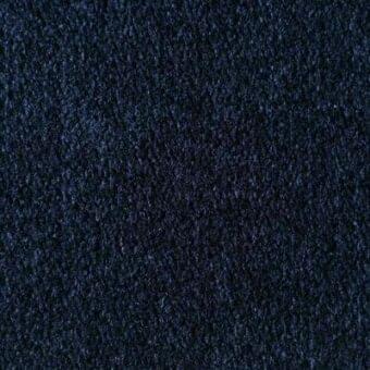 Midnight blue fabric texture with a granular woven construction, displaying a uniform and saturated dark tone, identified as Reflex via Baguta.