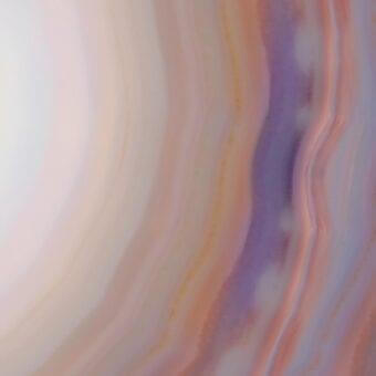 Translucent layered surface with pale peach, white, and lavender bands, featuring warm amber streaks and a smooth, reflective finish.
