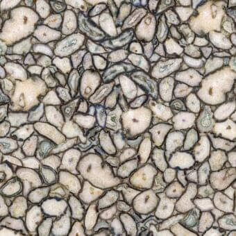 Stone texture pale cream with dark blue-gray lines, featuring irregular slices and mottled patterns, resembling polished agate mineral composition.
