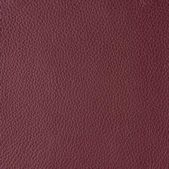 Burgundy leather texture sample displaying a dense grain pattern, labeled “reflex > leather > colorata > 131 amarena” along the bottom edge.