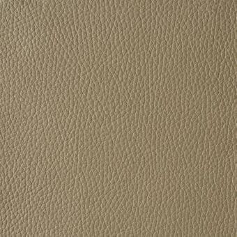 Tanned leather texture sample in nocciola tone, displaying a dense, irregular grain with a matte, slightly pebbled surface.