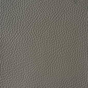 Gray full-grain leather texture sample, “reflex naturale n216 grigio,” displays a dense pebbled grain and consistent matte finish.