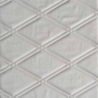 Diamond quilted textile, light gray fabric, parallel stitching creates geometric grid pattern, matte finish, consistent construction.