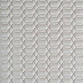 Light gray quilted fabric texture features a repeating hexagonal pattern with subtle tonal variations and consistent stitching.