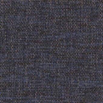 Charcoal gray woven fabric with blue and tan threads, displaying a dense, irregular nubby texture and intricate weave pattern.