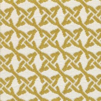 Kristal Ocra fabric sample, geometric woven pattern, golden-ochre and off-white, diagonal interlocking diamonds and crosses, textured surface.