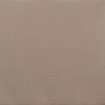 Acrylic fabric swatch in cappuccino, displaying a tight weave and subtle dotted texture, with brand label visible at the bottom edge.