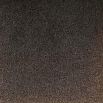 Dark brown rug with dense, granular texture and subtle tonal gradient, showcasing tightly woven construction for indoor flooring application.