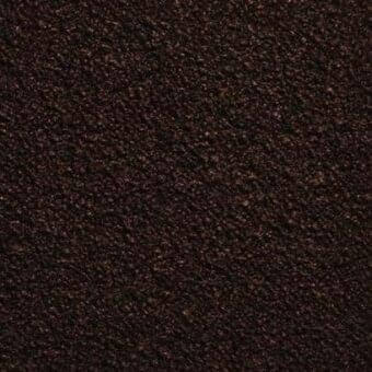 Dark brown textured rug with granular surface, mottled reddish-brown highlights, and rough woven construction shown in studio lighting.