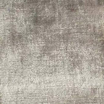 Rugiano Kaori 23 rug, gray and taupe woven fabric, dense texture with tonal variation from left to right, even lighting.