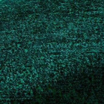 Rugiano rug, teal green indoor fabric, irregular textured surface with mottled, organic arrangement and subtle tonal variations.