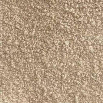 Beige textured rug with dense, nubby looped pile and subtle shading variations across the surface.