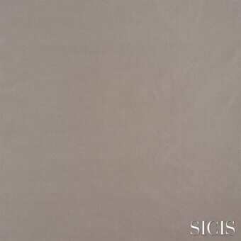 Sicis Borea fabric sample in sand tone, featuring a granular texture and matte finish with subtle color variations and brand imprint.