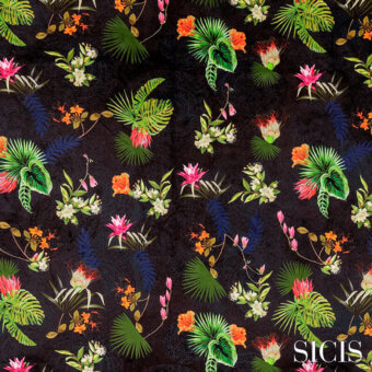 Sicis Jardin fabric with tropical foliage, dark background, green palm leaves, orange and pink flowers, blue stalks, textured surface.