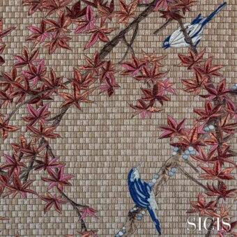 Maple fabric design with grey brick texture, autumnal foliage, and two bluebirds holding pearls, detailed stitching throughout.