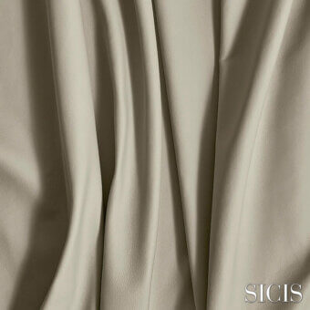 Sicis leather sample in Balmoral Greige, showing vertical pleats and a matte finish with subtle grain and warm gray color variations.