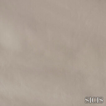 Sicis leather sample in delaware sand, exhibiting a matte finish and granular texture, with gold-toned brand text.