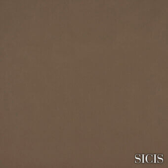 Sicis Oregon Licorice leather sample, matte dark brown, granular texture, gold brand text, plain background.