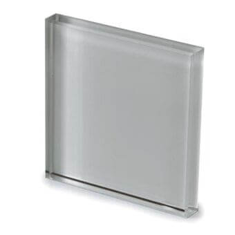 Lacquered glass panel, gray tone, textured surface with horizontal line; Sovet Italia Tec3 cement finish sample against white backdrop.