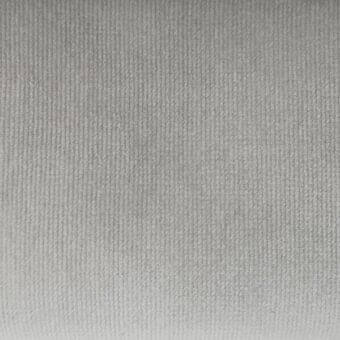 Gray velvet fabric texture with vertical ribs, displaying a consistent linear pattern and subtle sheen across a dense, plush surface.