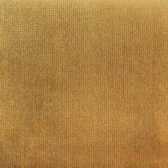 Velvet fabric texture, muted gold tone, consistent short pile with subtle tonal variations and even lighting.