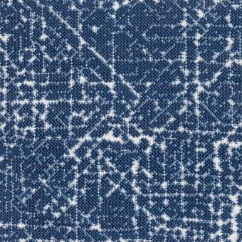 Polypropylene fabric sample, deep blue and off-white, featuring irregular branching patterns with a granular texture.