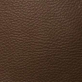 Dark brown pebbled texture with an irregular pattern of small bumps, displaying a dense and tactile surface with subtle tonal variations.