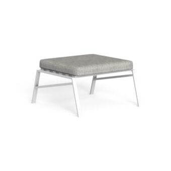 Gray woven ottoman with white metal frame and curved legs, studio shot, minimalist design, geometric shape, raised cushion edge.