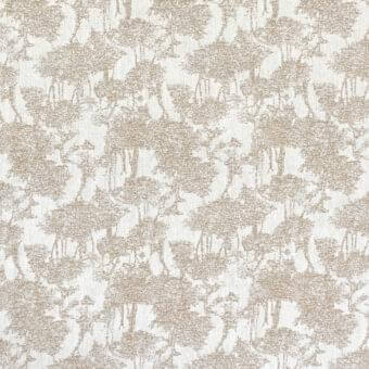 Floral cushion textile, muted gold blooms on cream, distressed pattern with granular texture, linen-like fabric, warm neutral palette.