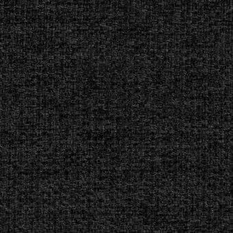 Dark gray woven fabric texture with a granular, nubby surface and heathered effect from interwoven fibers, studio lighting.